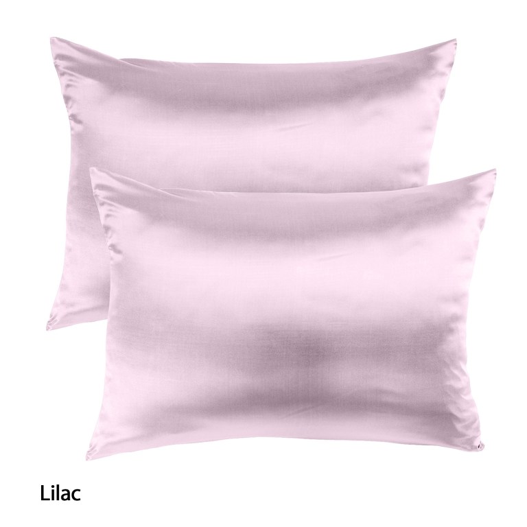 Lilac silk pillowcases set against white background