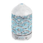 Decorative oil diffuser with intricate blue pattern.