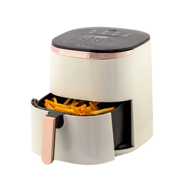 Modern air fryer with cooked chips inside.