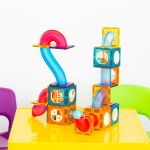 88 pcs non toxic stem educational, durable magnetic tiles/puzzle with storage bag Colourful magnetic building tiles on yellow table