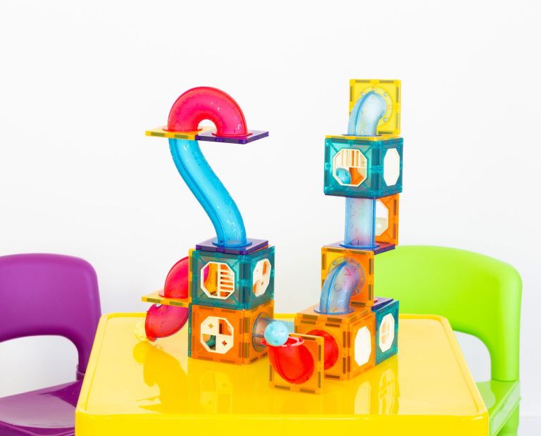 88 pcs non toxic stem educational, durable magnetic tiles/puzzle with storage bag Colourful magnetic building tiles on yellow table