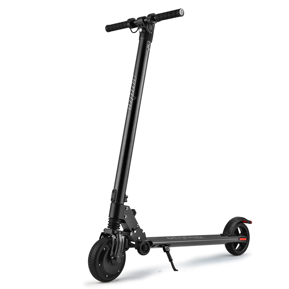 Black electric scooter with stand on white background.