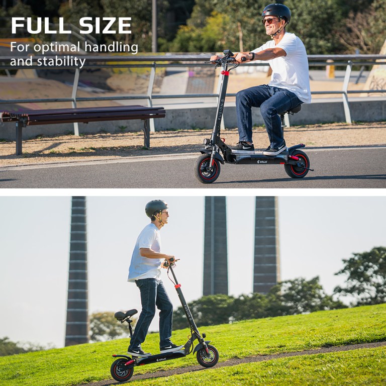 Man riding scooter for stability in park.