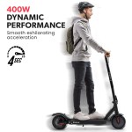 valk 400w electric scooter, 37v folding e scooter with suspension, for adults, synergy 5 mkii black Man riding VALK electric scooter with 400W power.