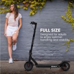 valk 400w electric scooter, 37v folding e scooter with suspension, for adults, synergy 5 mkii black Woman with electric scooter in urban setting.