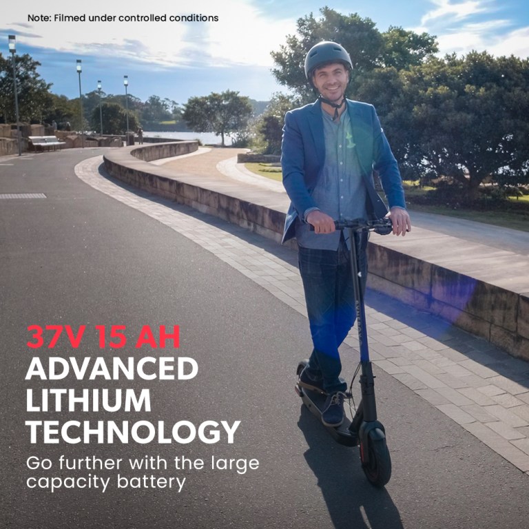 Person riding scooter with lithium battery technology.