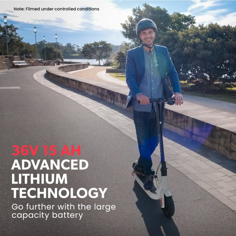 valk synergy 7 mkii electric scooter 500w 15ah, motorised escooter for adults, white Man on e-scooter with advanced lithium battery.