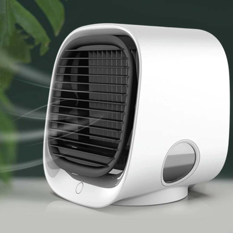 Compact white air cooler on a table