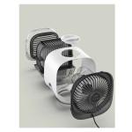 Disassembled fan with visible components on display.