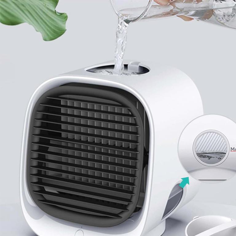 Pouring water into compact air cooler.