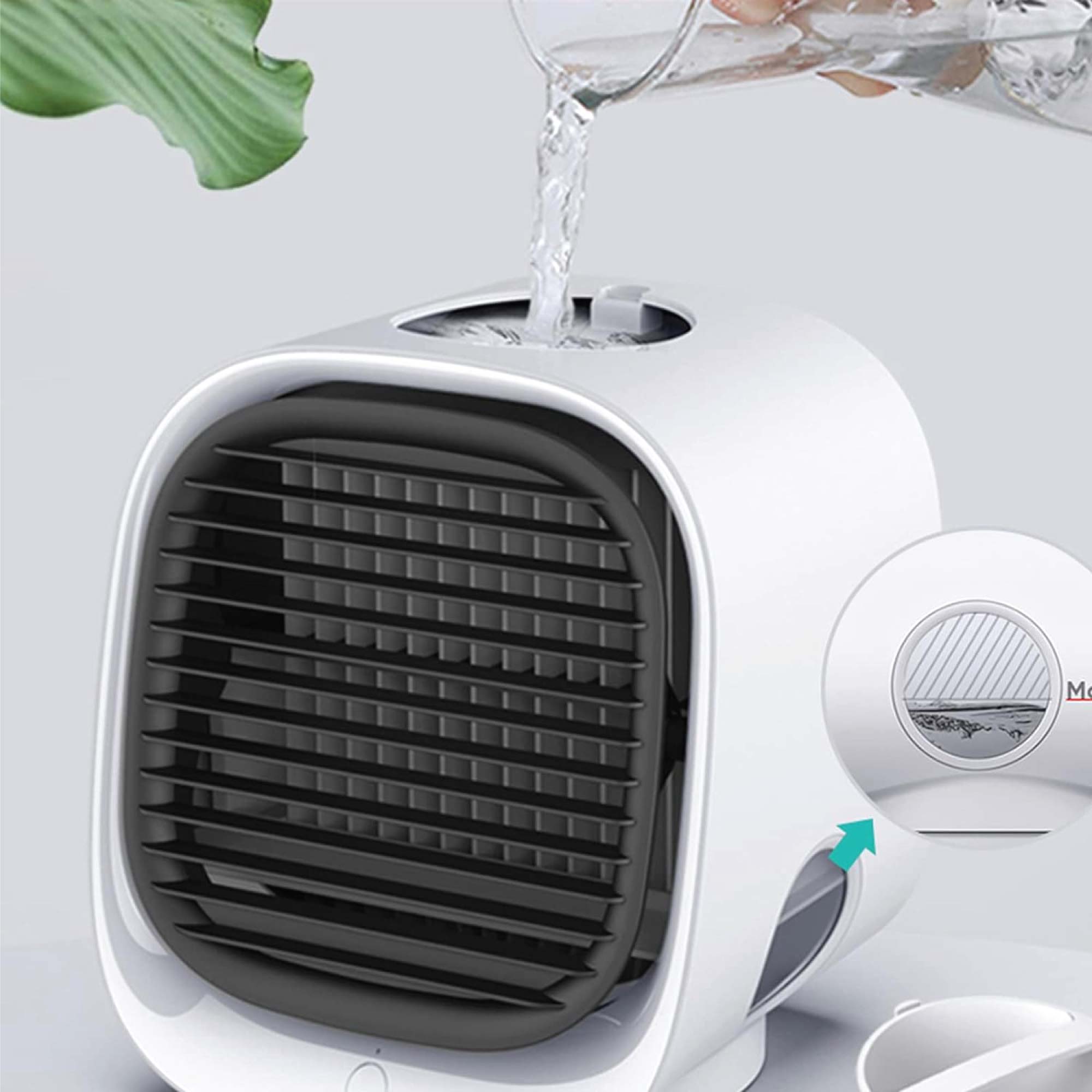 Pouring water into compact air cooler.