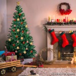 christabelle green christmas tree 1.8m xmas decor decorations 850 tips Festive Christmas tree and stockings by fireplace.