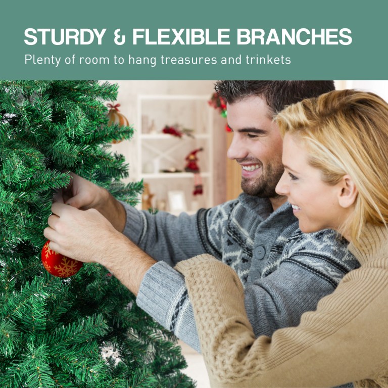 Couple decorating Christmas tree with ornaments.