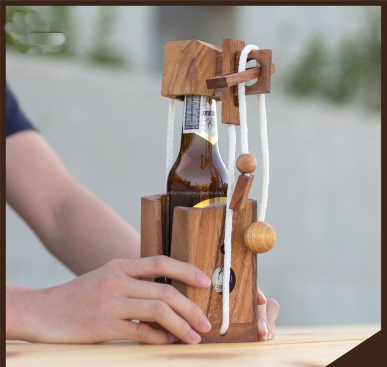 Hand solving wooden puzzle bottle holder.