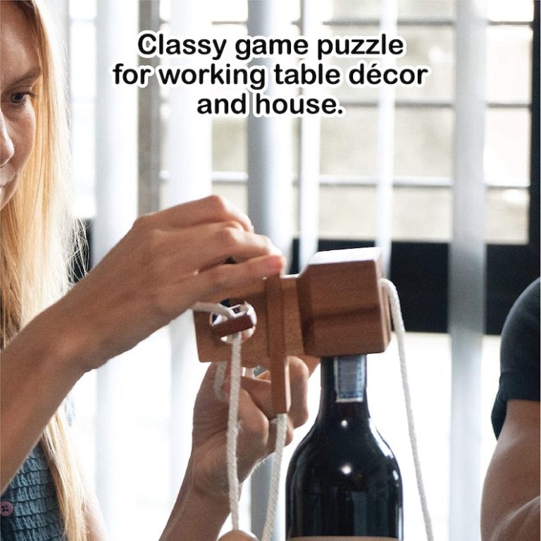 Wooden puzzle on wine bottle, table decor.