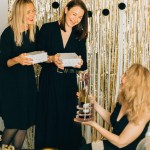 wine stopper lock puzzle party puzzle cant drink it until you crack the lock party fun Women exchanging gifts at party celebration