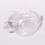 Clear glass Christmas bauble on white background.