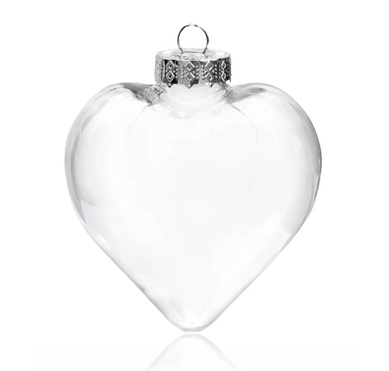 Clear glass heart ornament with silver cap.