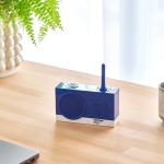 Blue Pantone radio on wooden table