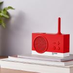 Red retro speaker on stacked books