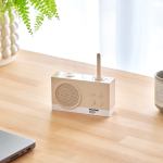 lexon thykho 3 fm radio & bluetooth speaker pantone sand Beige radio with antenna on wooden desk.
