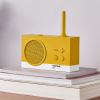 Yellow retro radio on stacked books