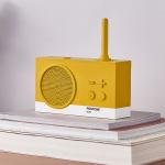 Yellow retro radio on stacked books