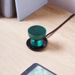 lexon tamo infinitely pairable bluetooth speaker green Green desktop speaker on wooden table, minimal design.