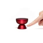 lexon tamo infinitely pairable bluetooth speaker red Finger touching compact red wireless speaker.