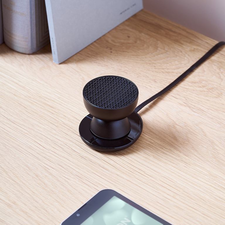 lexon tamo infinitely pairable bluetooth speaker black Compact black desk speaker on wooden surface