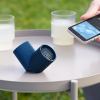 Bluetooth speaker and smartphone on outdoor table