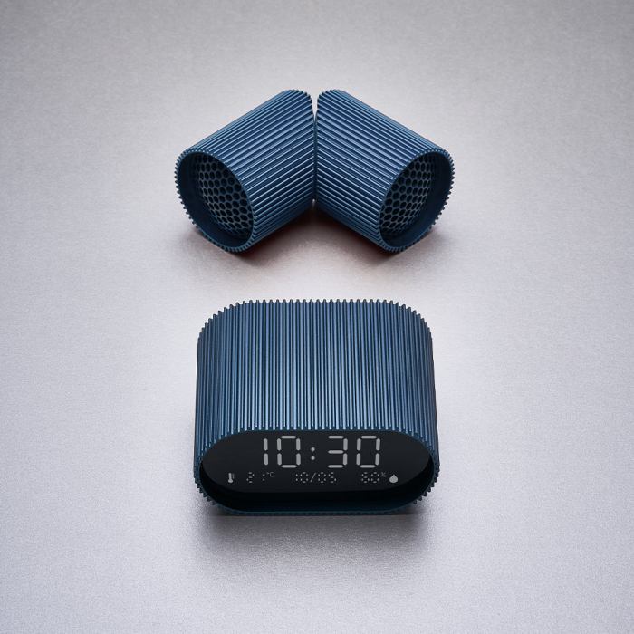 Modern blue alarm clock with sleek design.