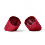 Two red modern mesh plant pots on display