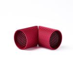 Red perforated cylindrical objects on white background.