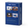lexon gift set pantone includes mino+ mini speaker, flip classic clock, mina m lamp, thykho 3 speaker classic blue Lexon Pantone box showcasing electronic products.