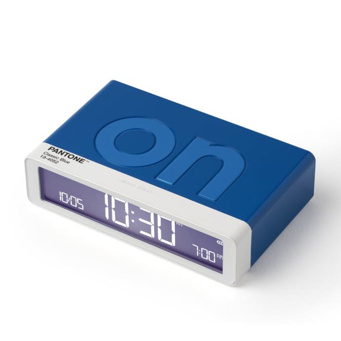 lexon gift set pantone includes mino+ mini speaker, flip classic clock, mina m lamp, thykho 3 speaker classic blue Blue Pantone clock showing time 10:30.