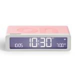 lexon gift set pantone includes mino+ mini speaker, flip classic clock, mina m lamp, thykho 3 speaker rose pink Pink digital alarm clock displaying 10:30 AM.