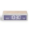 lexon gift set pantone includes mino+ mini speaker, flip classic clock, mina m lamp, thykho 3 speaker sand Digital clock displaying 10:30 AM with beige casing.