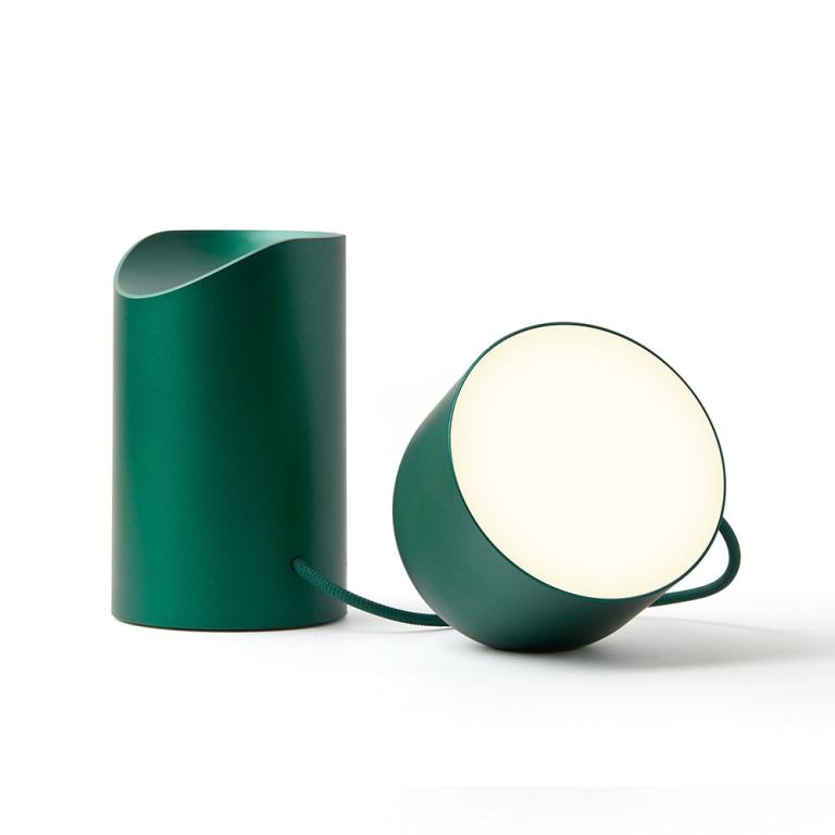 Green modern table lamp with cylindrical base.