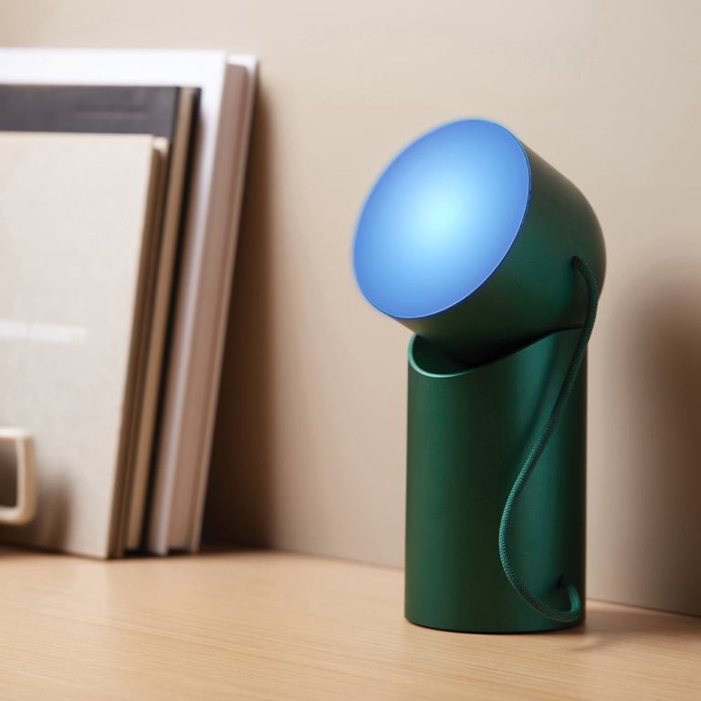 Modern green desk lamp with blue light.