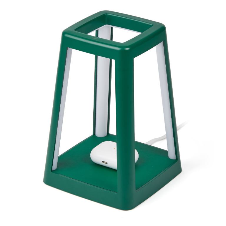 Green modern lamp with wireless charging base.