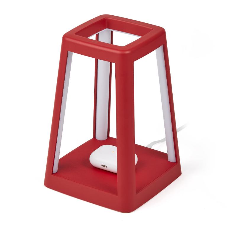 Red wireless charger with geometric design.