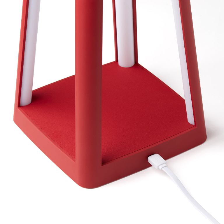 Red lamp base with USB charging cable.