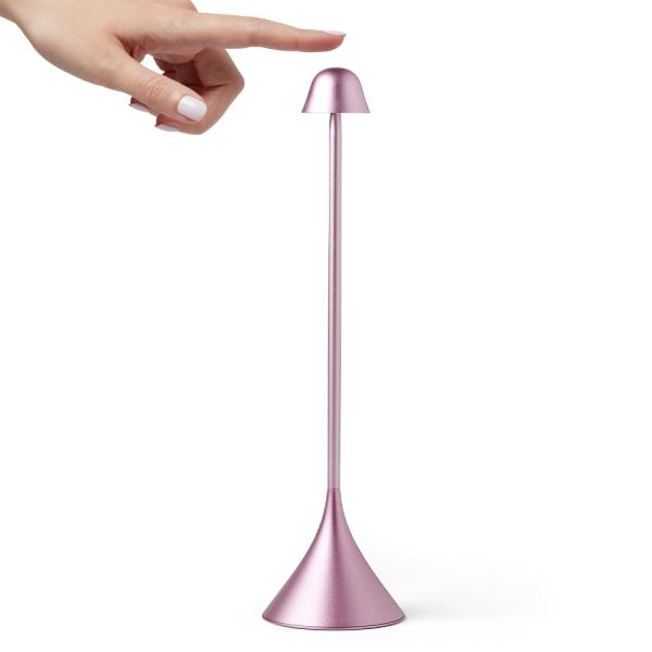 lexon steli bell infinitely pairable table lamp pink Touch-sensitive pink tall lamp being activated