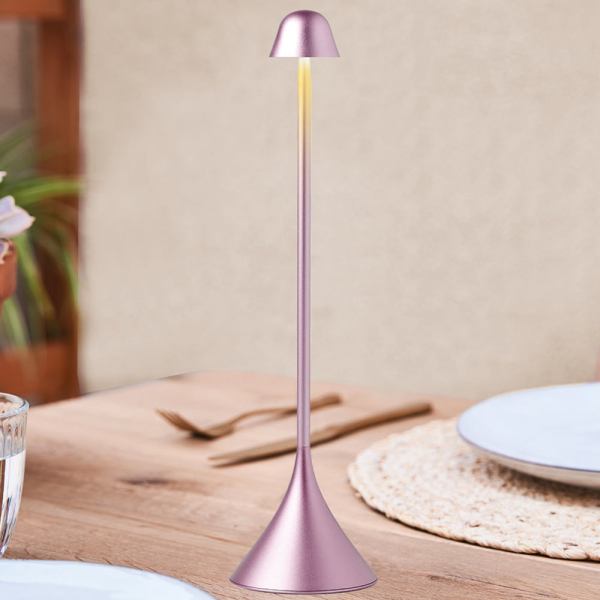 lexon steli bell infinitely pairable table lamp pink Modern pink table lamp on wooden table.