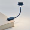 lexon mimi flexible led lamp dark blue Clip-on book reading light on hardcover book.