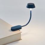 lexon mimi flexible led lamp dark blue Clip-on book reading light on hardcover book.