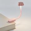 lexon mimi flexible led lamp pink Pink clip-on book light illuminating pages