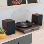 majority moto plus turntable Turntable with speakers and vinyl on shelf.
