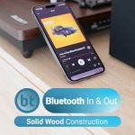 majority moto plus turntable Smartphone with music player on wooden surface.